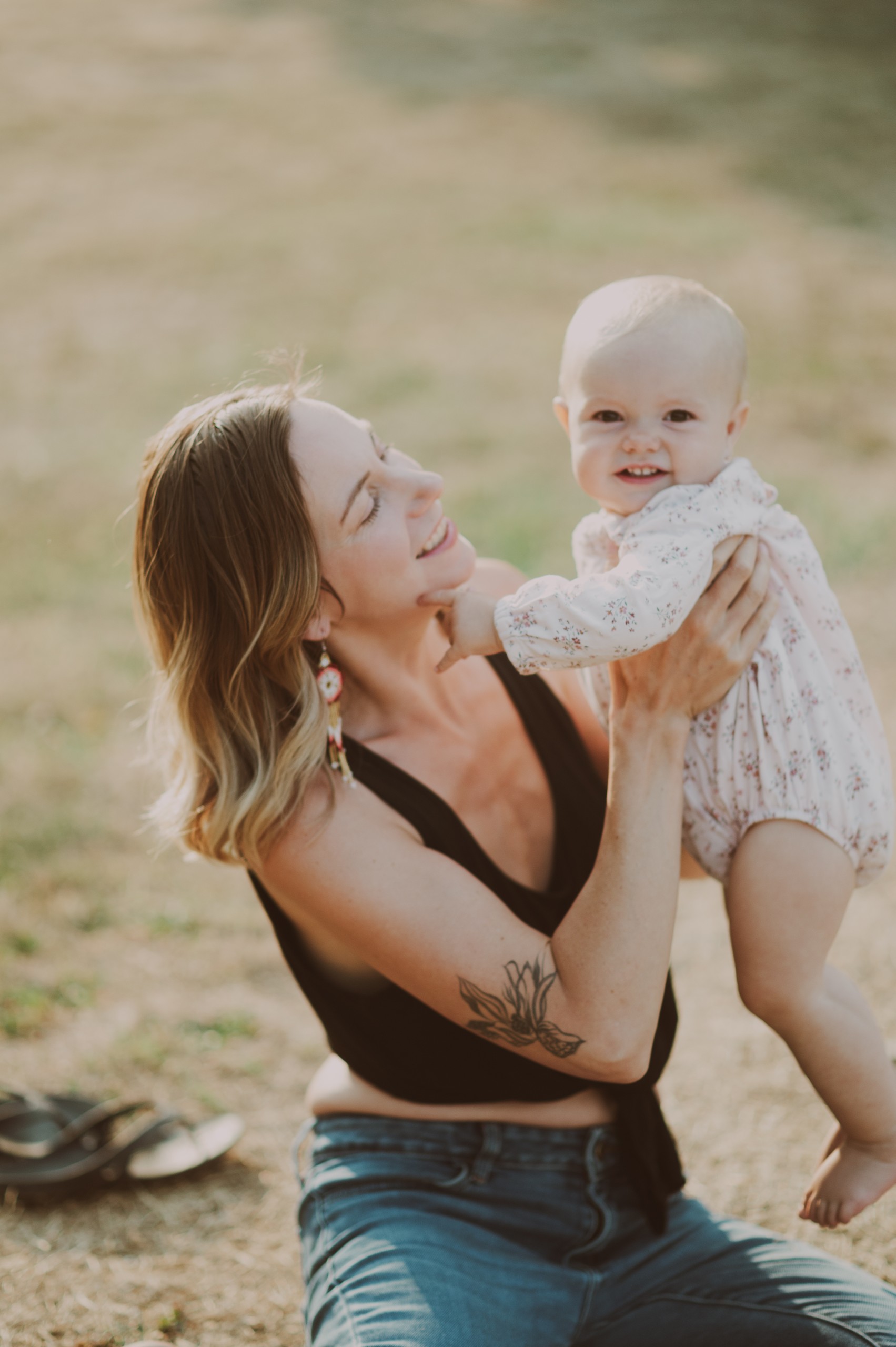 Mother lifting baby